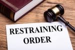 Restraining order papers and gavel